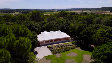 slow establishing shot of a beer garden setup for a party in the countryside