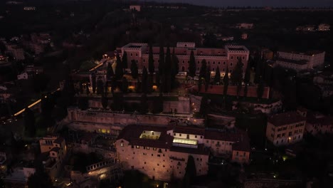 aerial pull-back drone shot of verona roman theater at blue hour