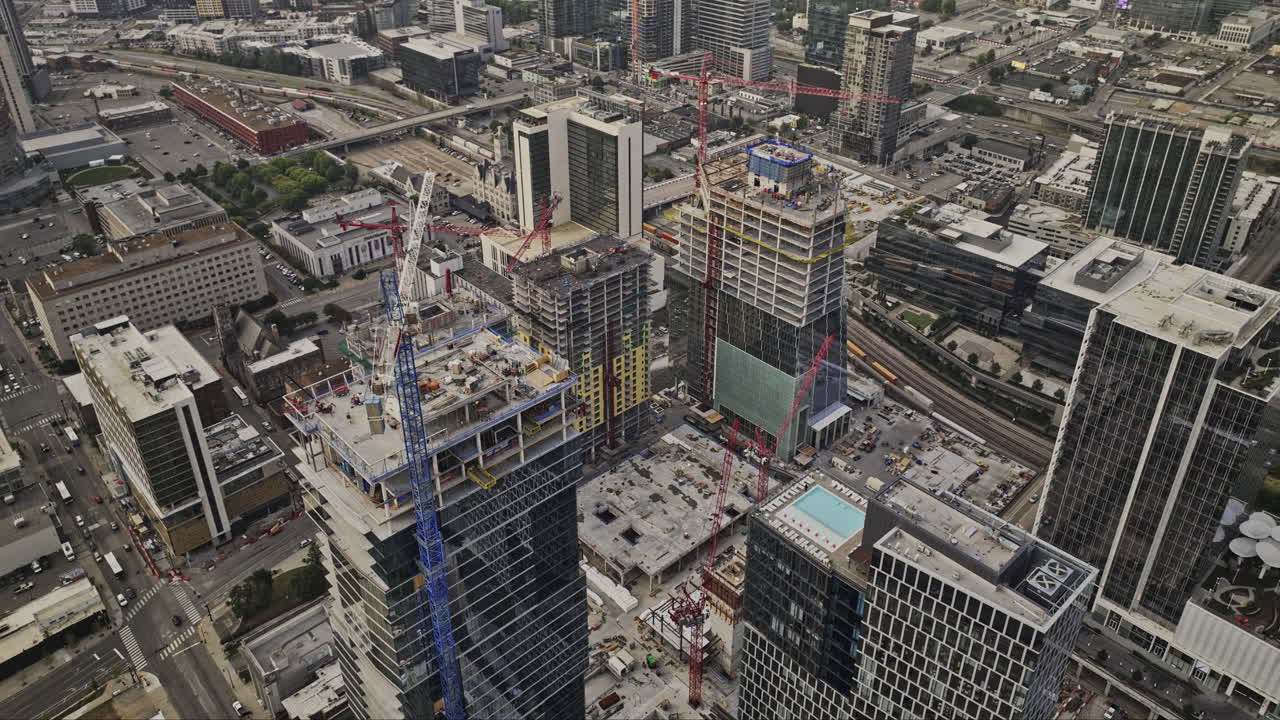 Nashville Tennessee Aerial v101 flyover downtown capturing an urban development under construction for entertainment, retail, office and residential space - Shot with Mavic 3 Pro Cine - Sept 21st 2023