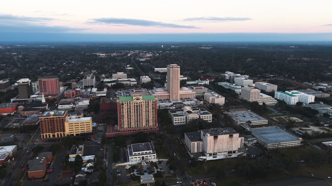 Aerial view rotating away from downtown Tallahassee, dusk in Florida, USA