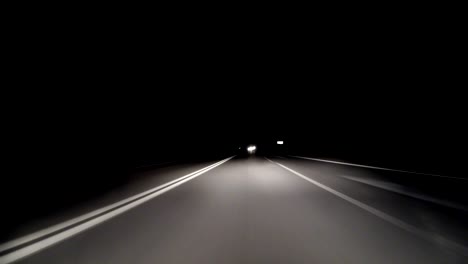 pov timelapse fast car drive old countryroad at night. flow of oncoming trucks. drive pov old road timelapse/hyperlapse night. pov night driving hyperlapse at highway passing a series of tunnels. camera is placed outside vehicle and level is horizontal