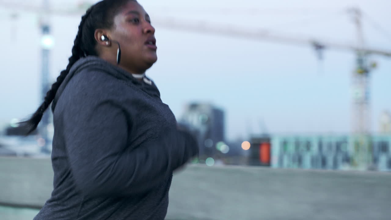 Plus size, black woman and running in urban city