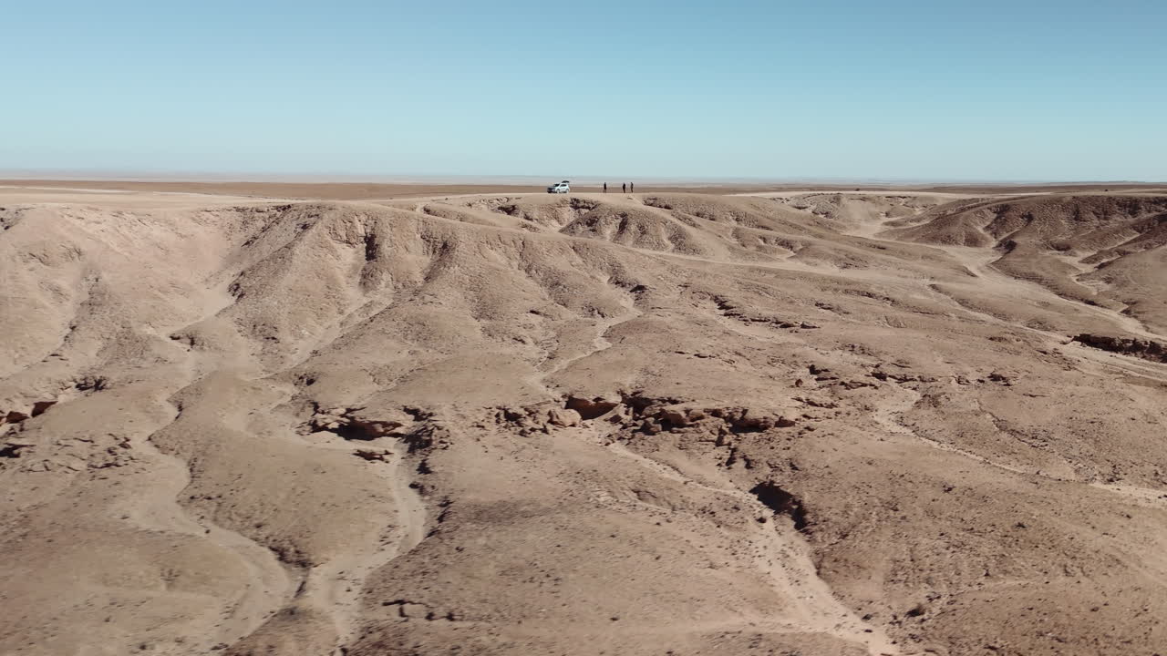 Desert Landscape with Vehicle and People