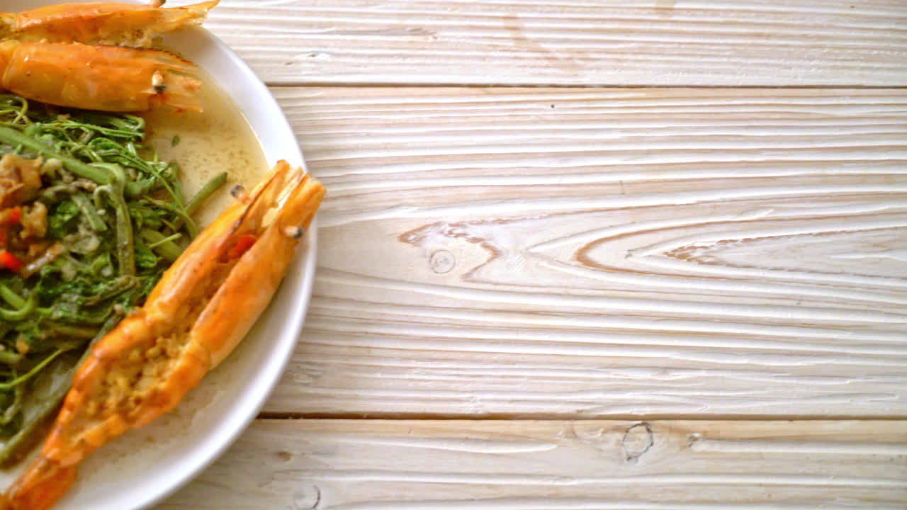 Stir-fried water mimosa with river prawns