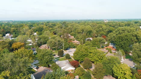 Suburban-Neighborhood-Aerial-Flying-Over-Trees-Houses
