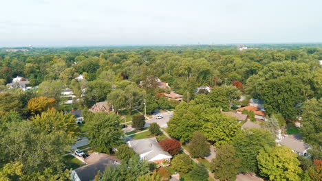 suburban neighborhood aerial flying over trees houses