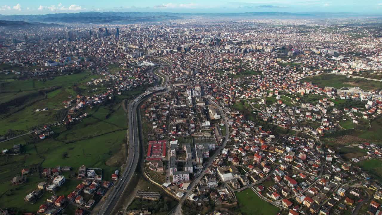 Suburb and industrial area near Tirana in Albania, wide panoramic view of capital city