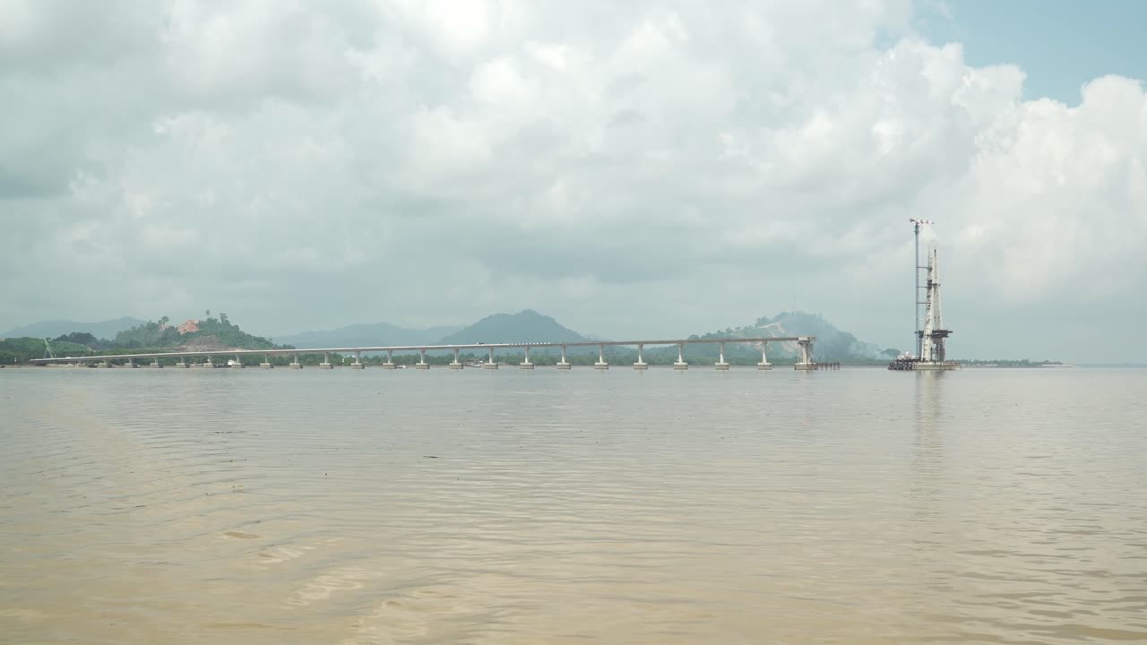 Batang Lupar Sarawak River Ferry Ride View During Summer And Under Construction Longest Bridge Conecting From each side,Sarawak,Borneo.