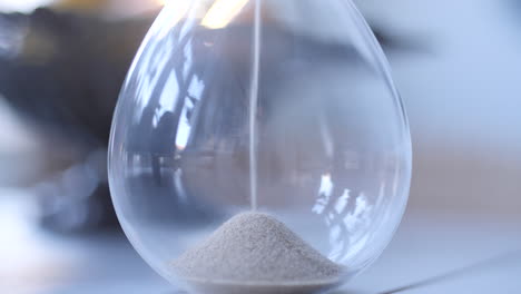 hourglass sand falling in slow motion