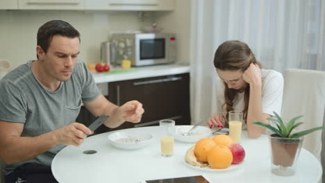 Happy-man-getting-good-news-at-breakfast.-Laughing-man-making-yes-gesture.