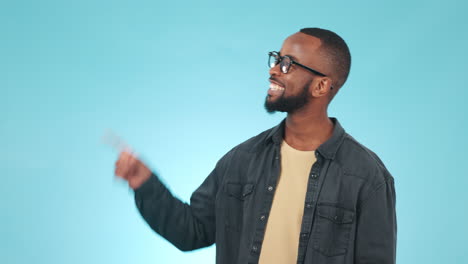 pointing, mockup and face of black man in a studio