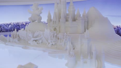 snow sculpture of disney castle