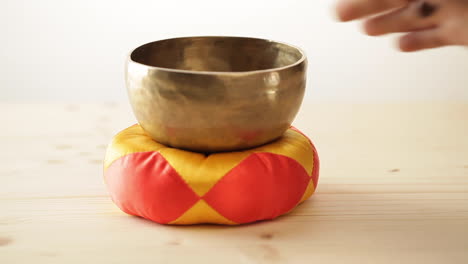 zen bell gong, zen environment, closeup, warm light