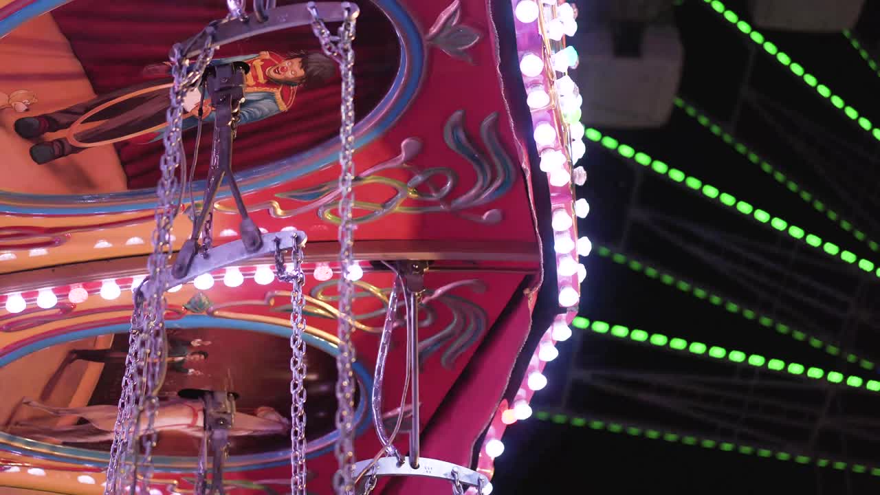 Colorful lights carousel at night in a park