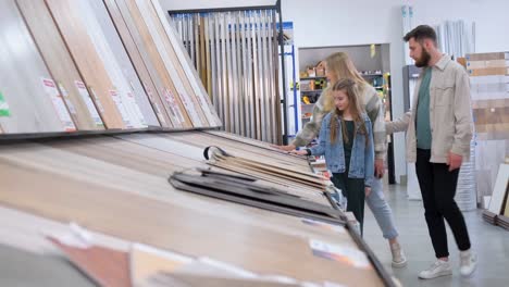 people shopping for flooring in a building store for their house