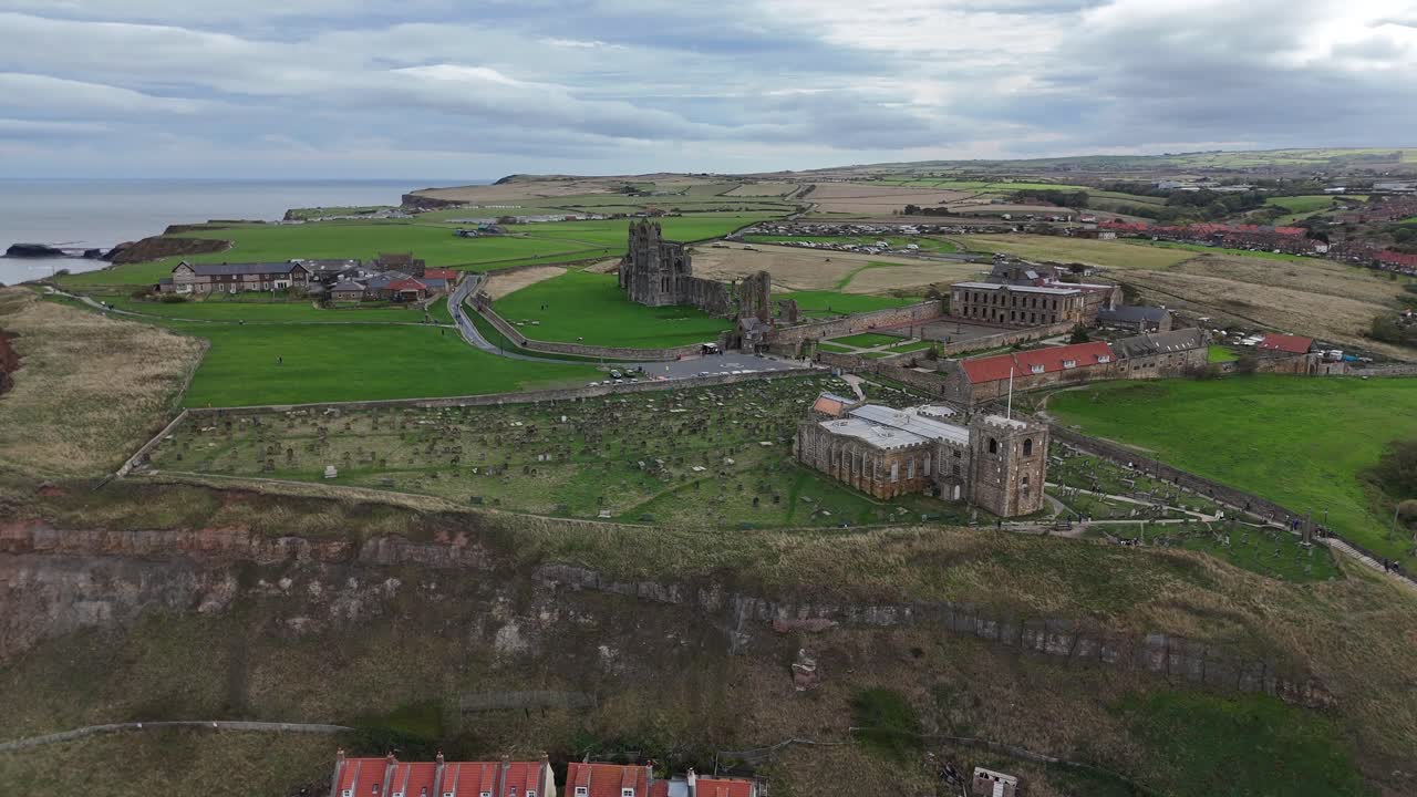 Aerial drone view Whitby Abbey north yorkshire british english seaside port harbour town city england uk