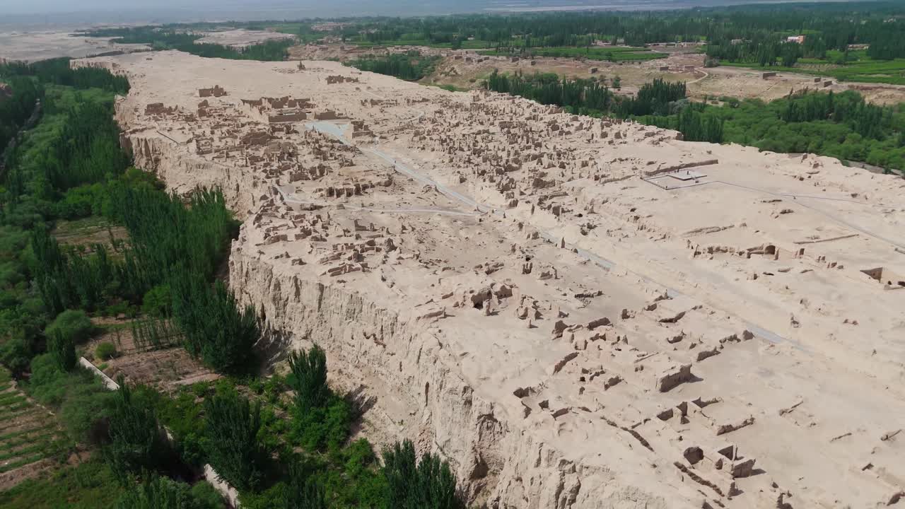 Aerial drone fly Leaf Shaped Plateau Hosting Jiaohe Ruins, China, natural fortress located atop a steep cliff