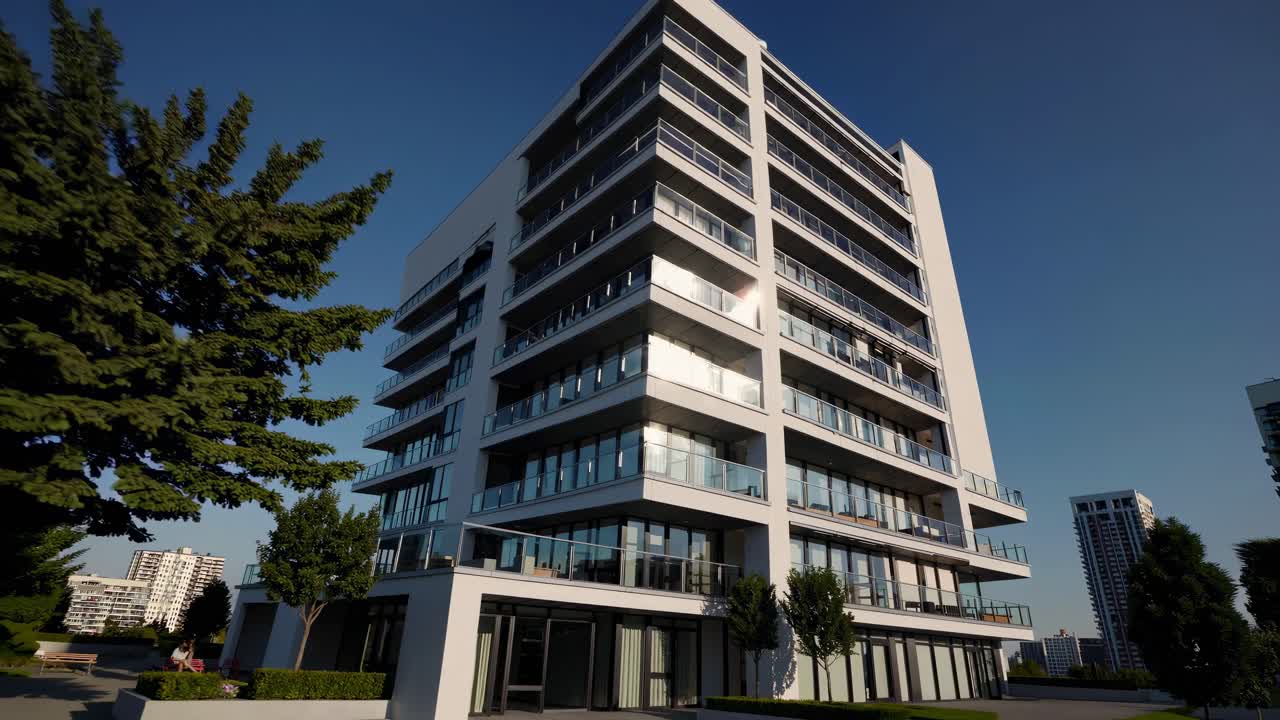 Low-angle shot of a modern apartment building against a clear sky, emphasizing its sleek design