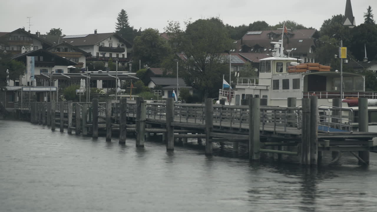 Handheld shot of a boat waiting for passengers to carry tothe next port at the lake Chiemsee