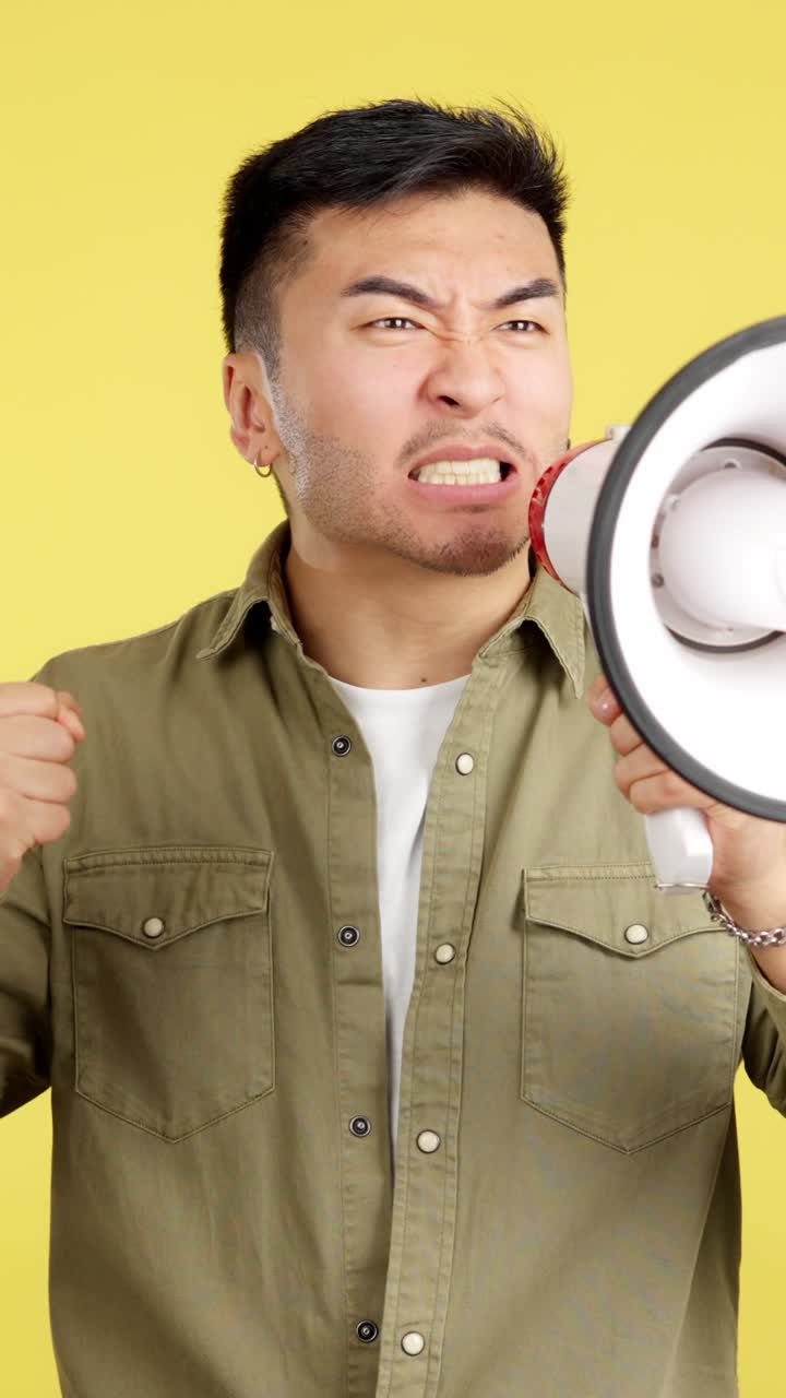 Angry man shouting into a megaphone