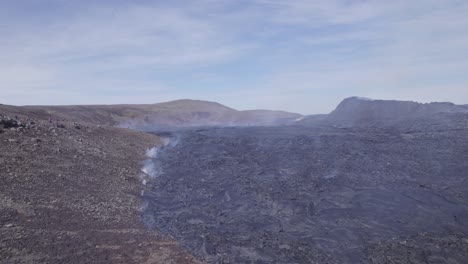 field of lava in the active volcanic region, geldingadalir, iceland - aerial drone shot