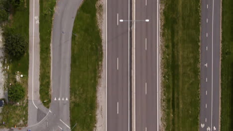 Aerial-top-down-forward-over-deserted-road-of-Vallingby-in-Stockholm,-Sweden