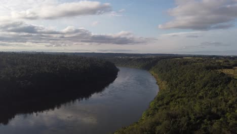 iguazu river flowing in amazon rainforest at border between brazil and argentina