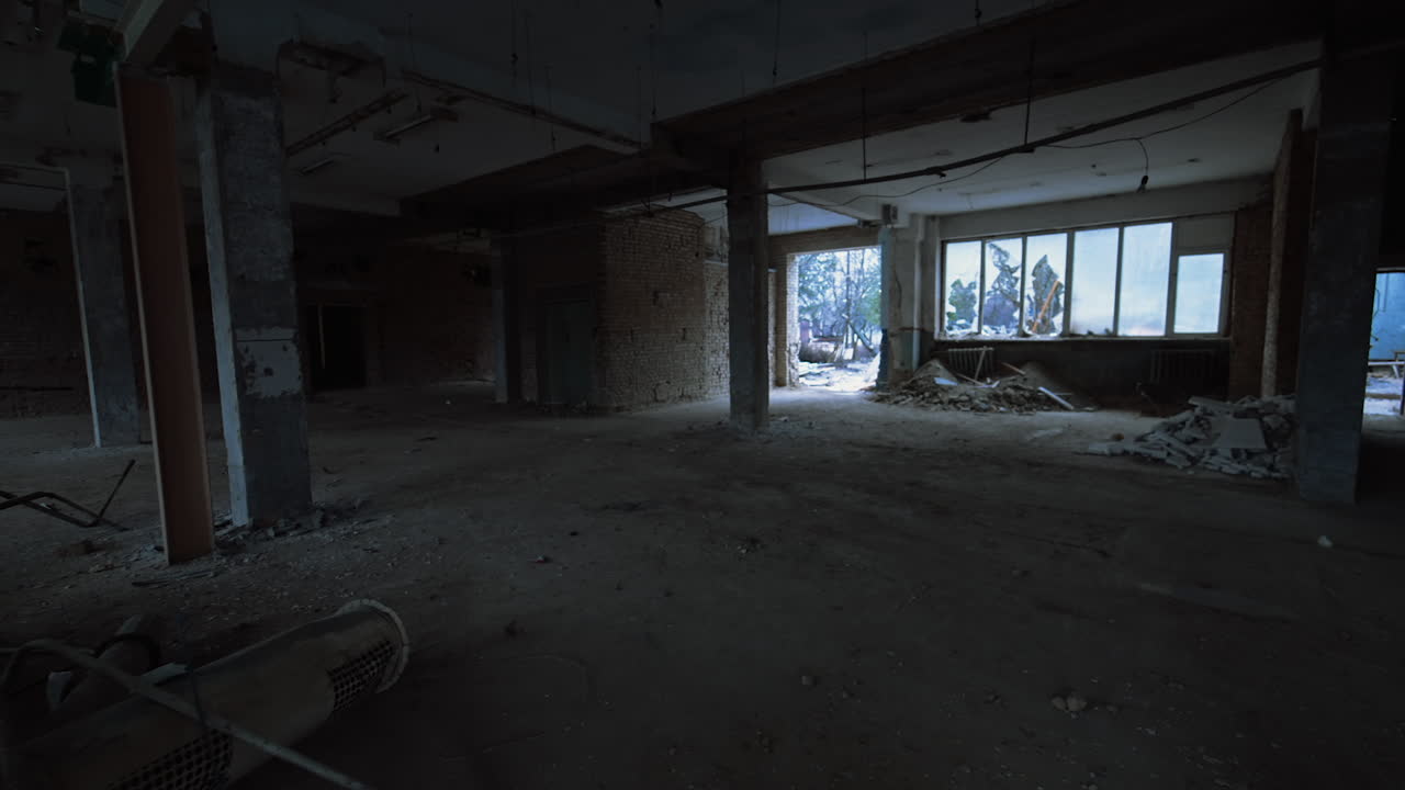 Building waste in a pile indoors the premise. Interior of a large room in a constructed building.