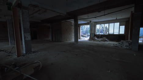 building waste in a pile indoors the premise. interior of a large room in a constructed building.