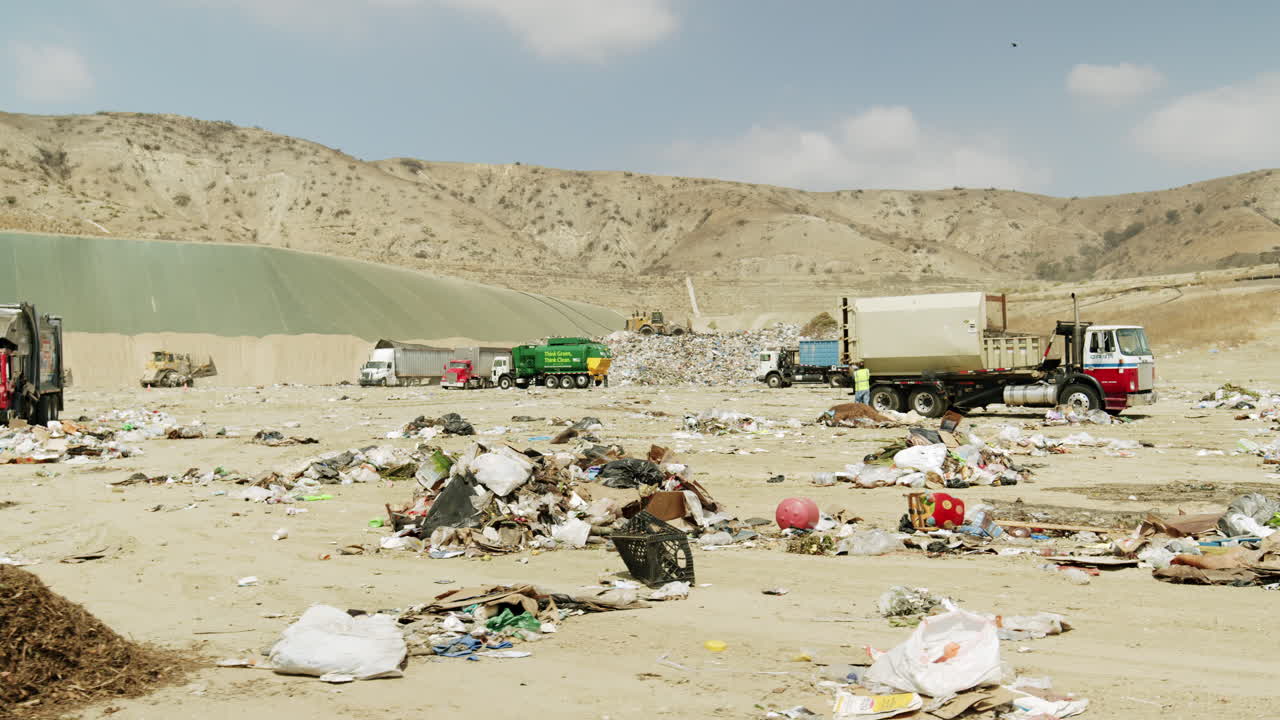 Landfill Operations with Multiple Garbage Trucks and Waste