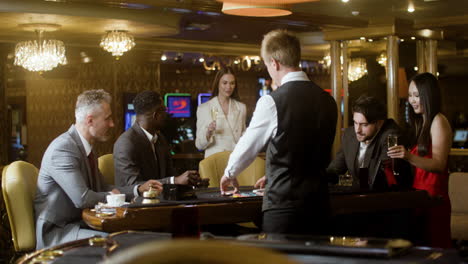 woman joining poker table to play in the casino.