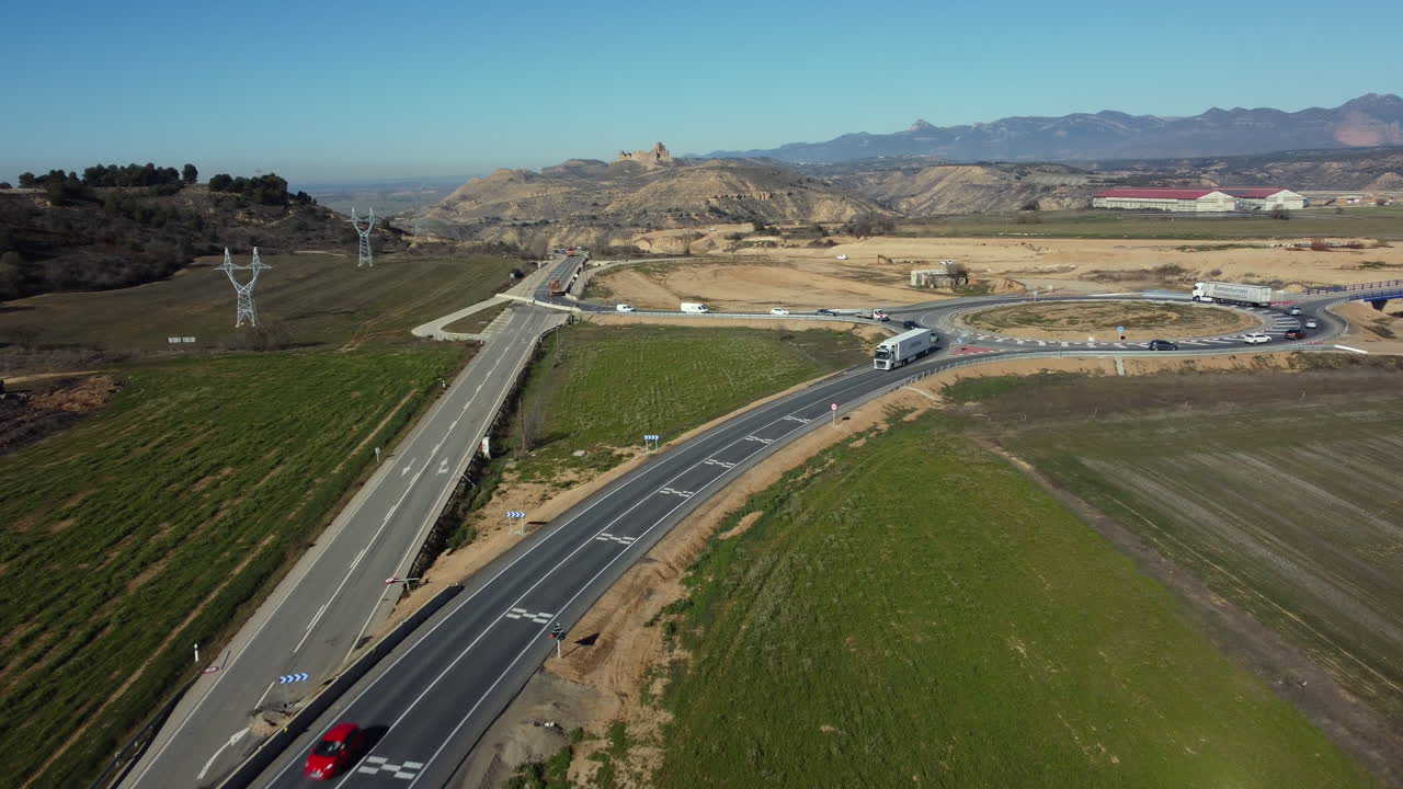 Highway Intersection with Roundabout and Rural Landscape