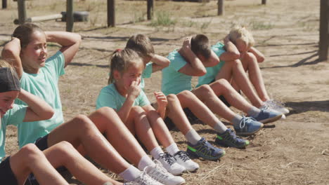 group of caucasian children training at boot camp