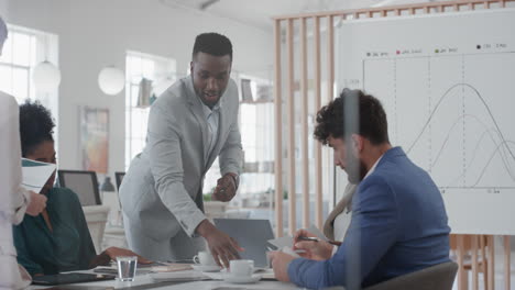 happy-african-american-businessman-celebrating-success-dancing-having-fun-enjoying-corporate-victory-in-boardroom-presentation-meeting