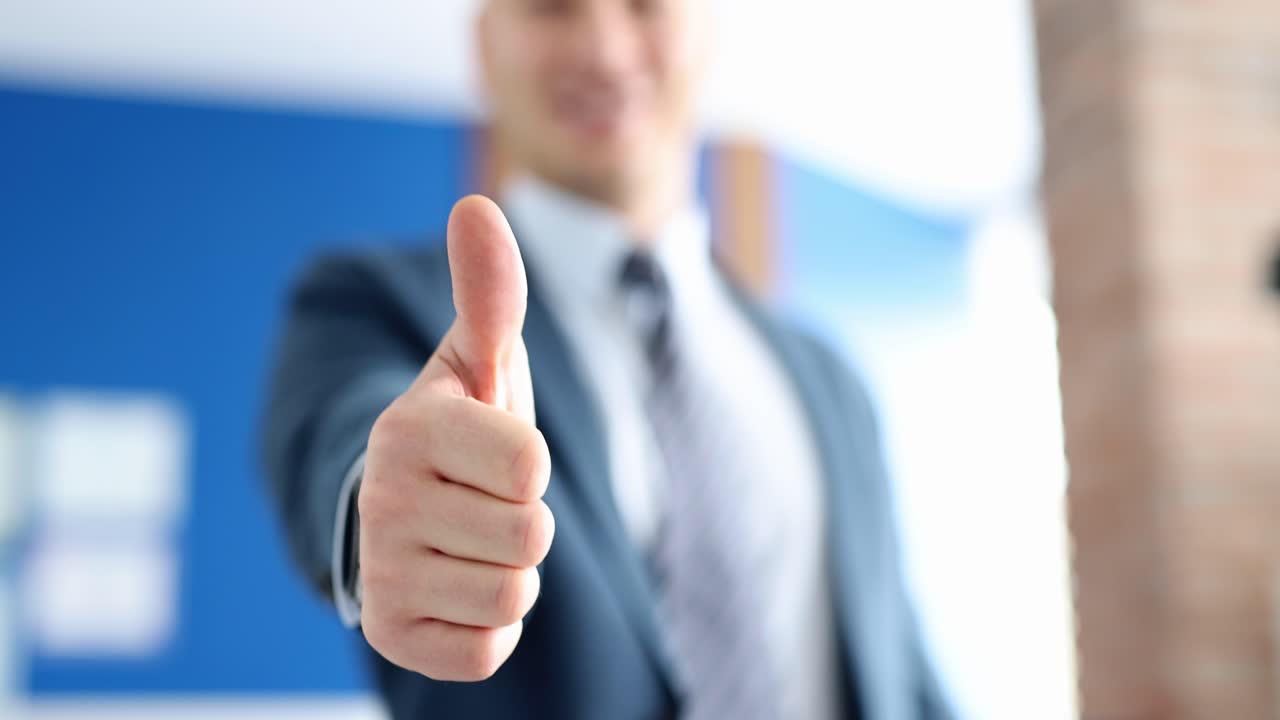 Businessman giving a thumbs up