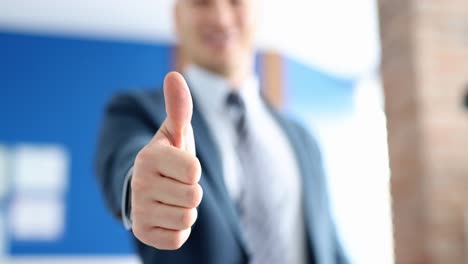 businessman giving a thumbs up