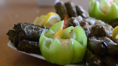 Green-pepper-has-fire-inside,-Attractive-way-of-eating,-Delicious-dolma-stuffed-grape-leaves-rice,-white-yogurt-sauce