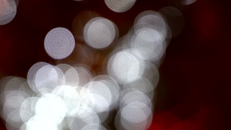 White bokeh on a red background