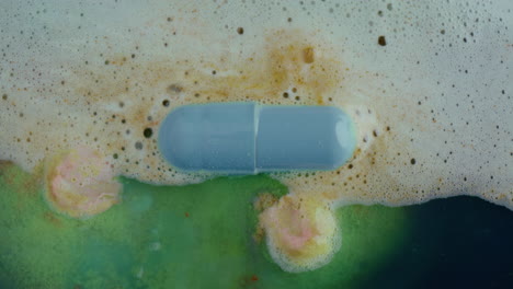 dissolving pill in soap solution