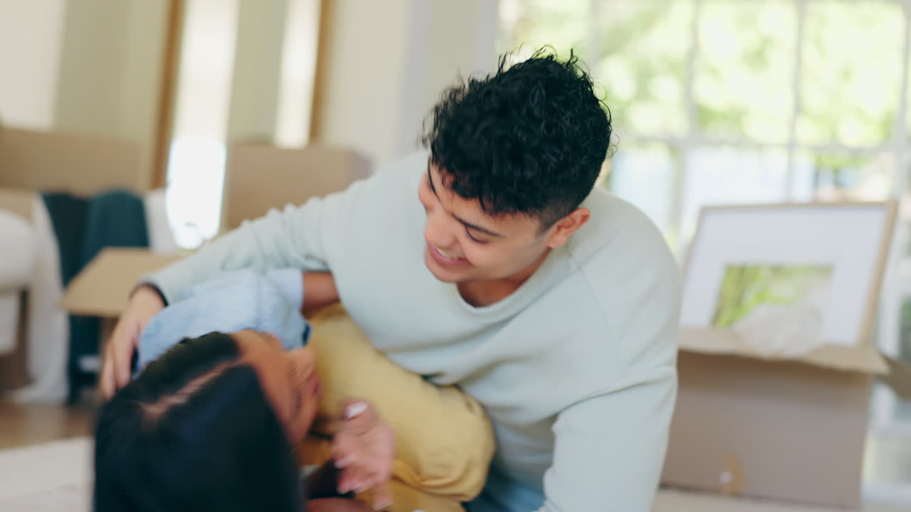Couple, tickle and moving boxes with fun