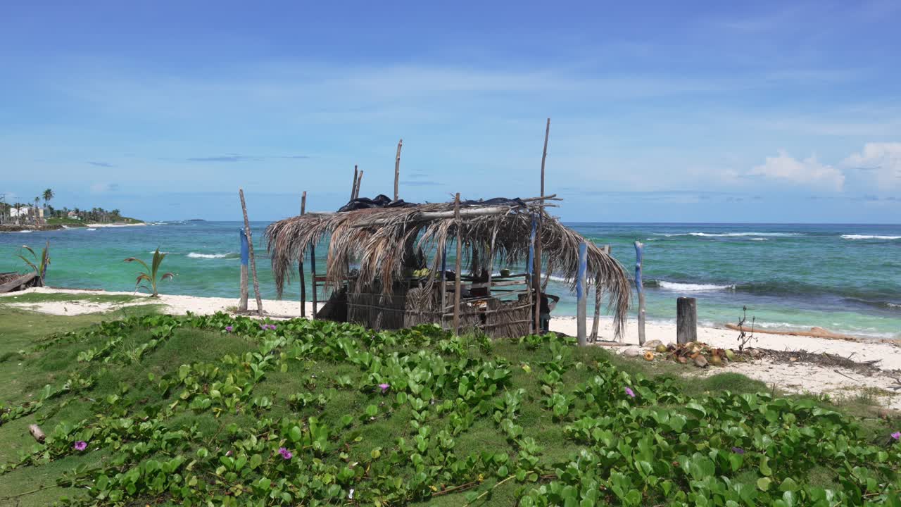 Small rustic shack on a tropical beach Caribbean sea coast in San Andres island
