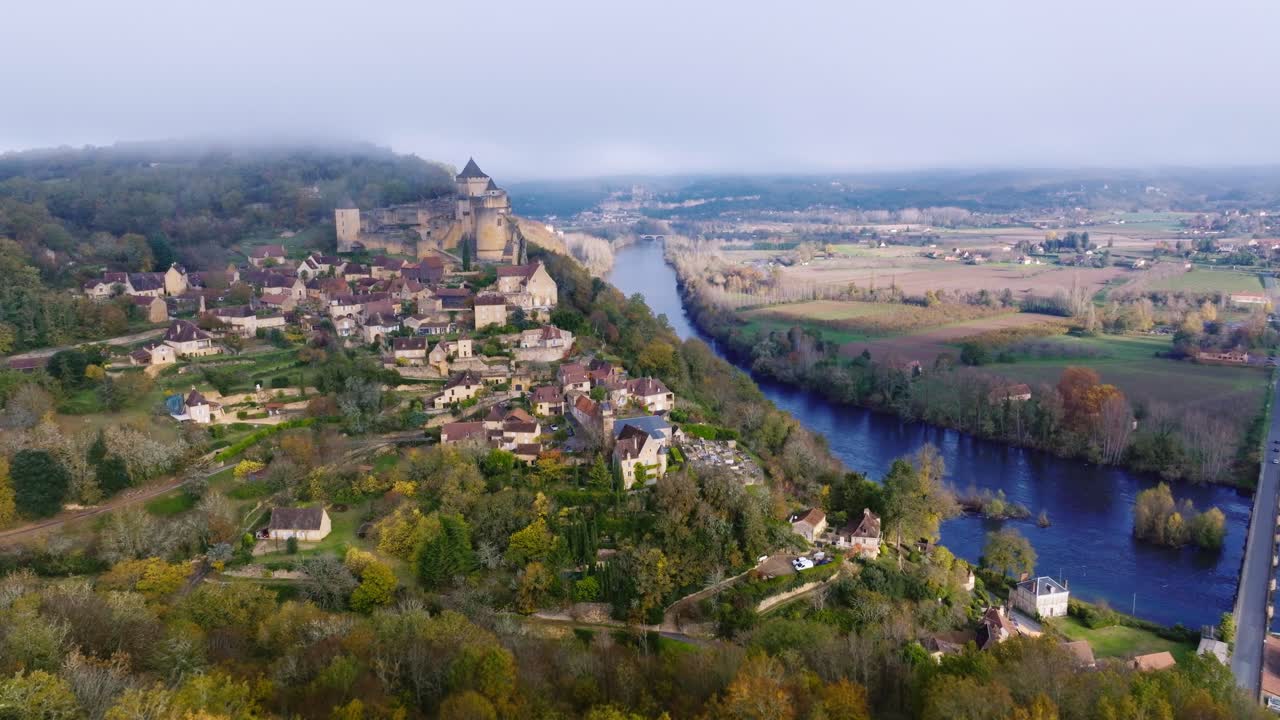 Wide aerial view of Castelnaud-la-chapelle, medieval village in Dordogne with unique castel