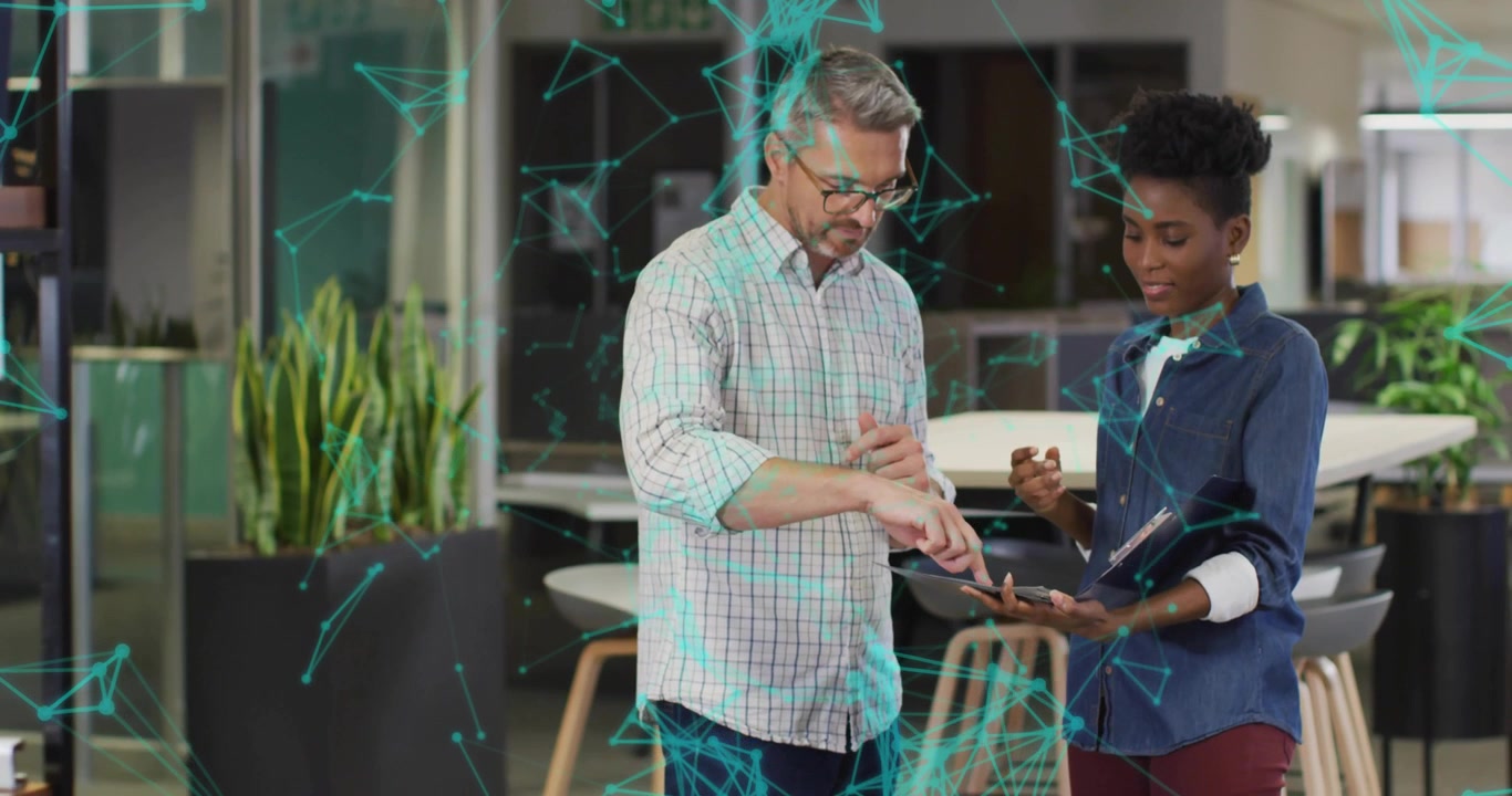Office man raising hands outlining digital project while woman using tablet showing pulsing overlay
