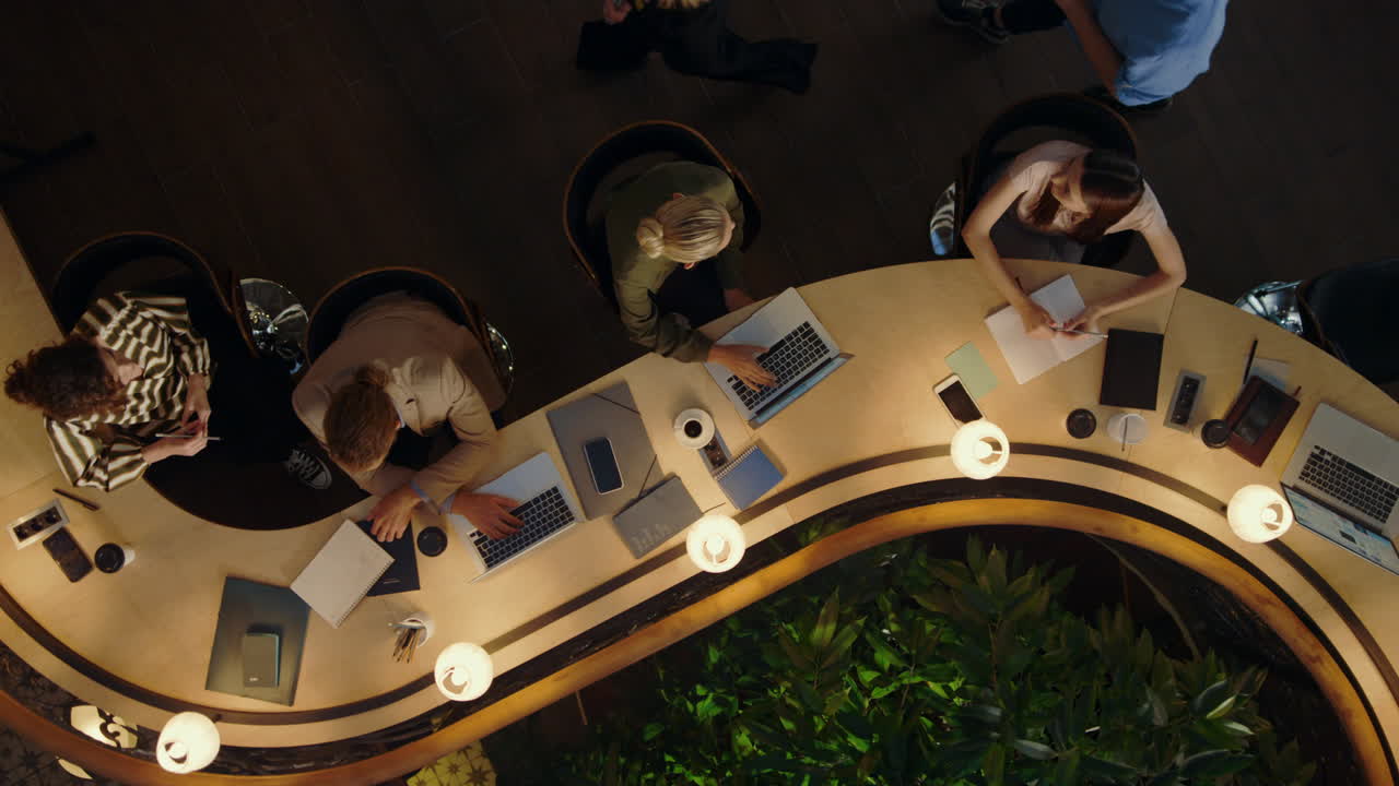 Team leader helping managers with work. People working with digital devices.