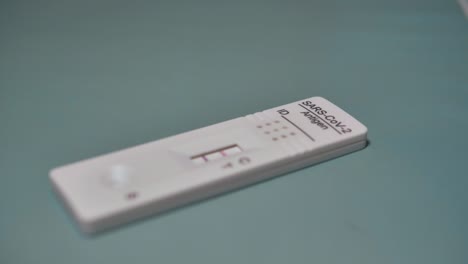 covid rapid antigen test positive result. infection, screening and treatment. slowmotion. scene e