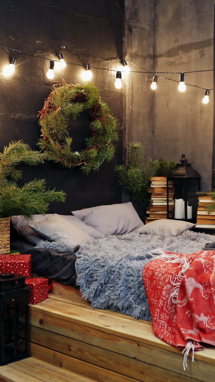 Cozy room with Christmas decorations. Christmas decorated bedroom with many lights and Christmas tree. Christmas tree with garlands. Vertical video