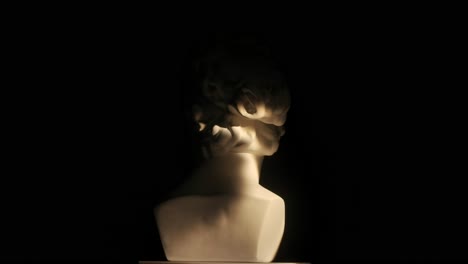 antique sculpture bust in low light