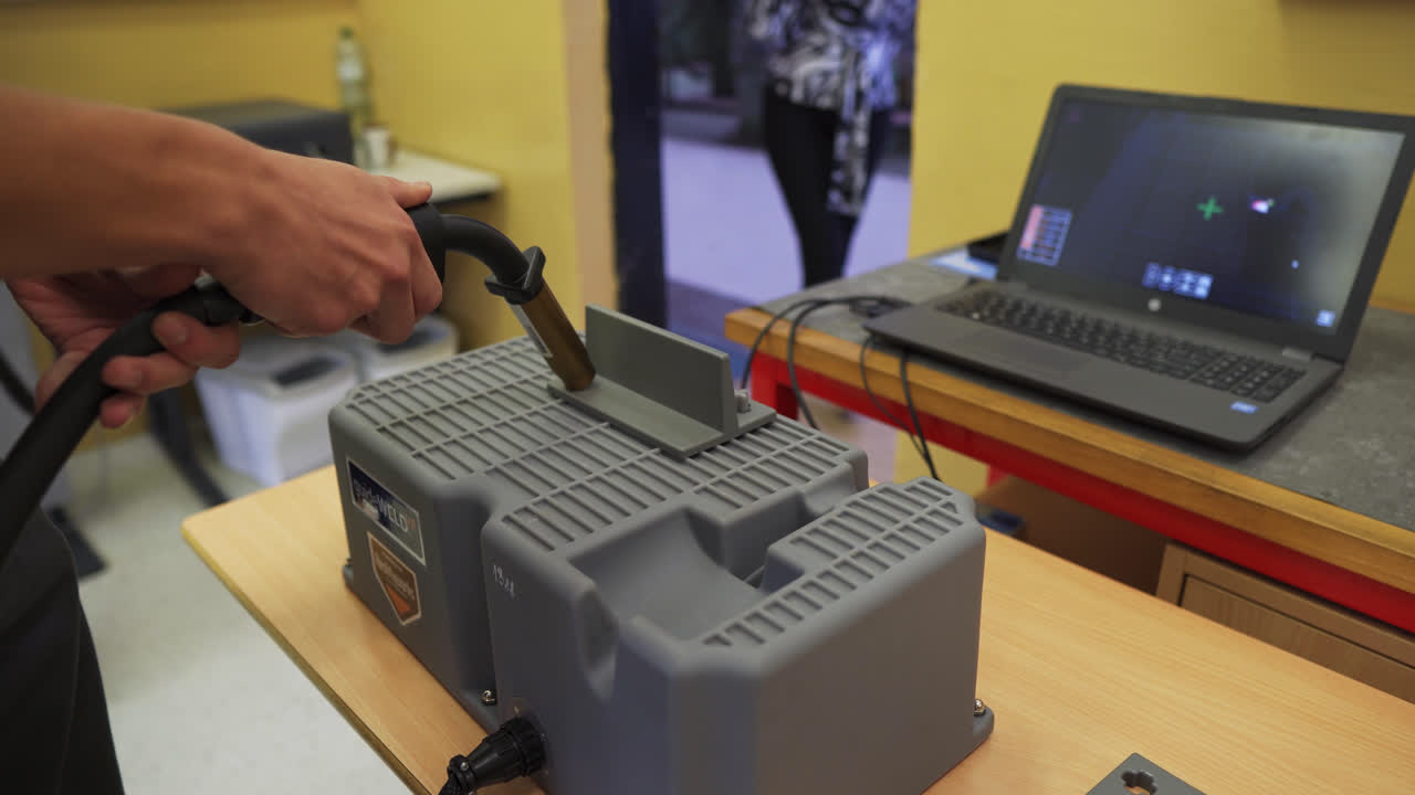 Modern Welding System With Weld Station Computer Used By Training Students In A Technical School. medium shot