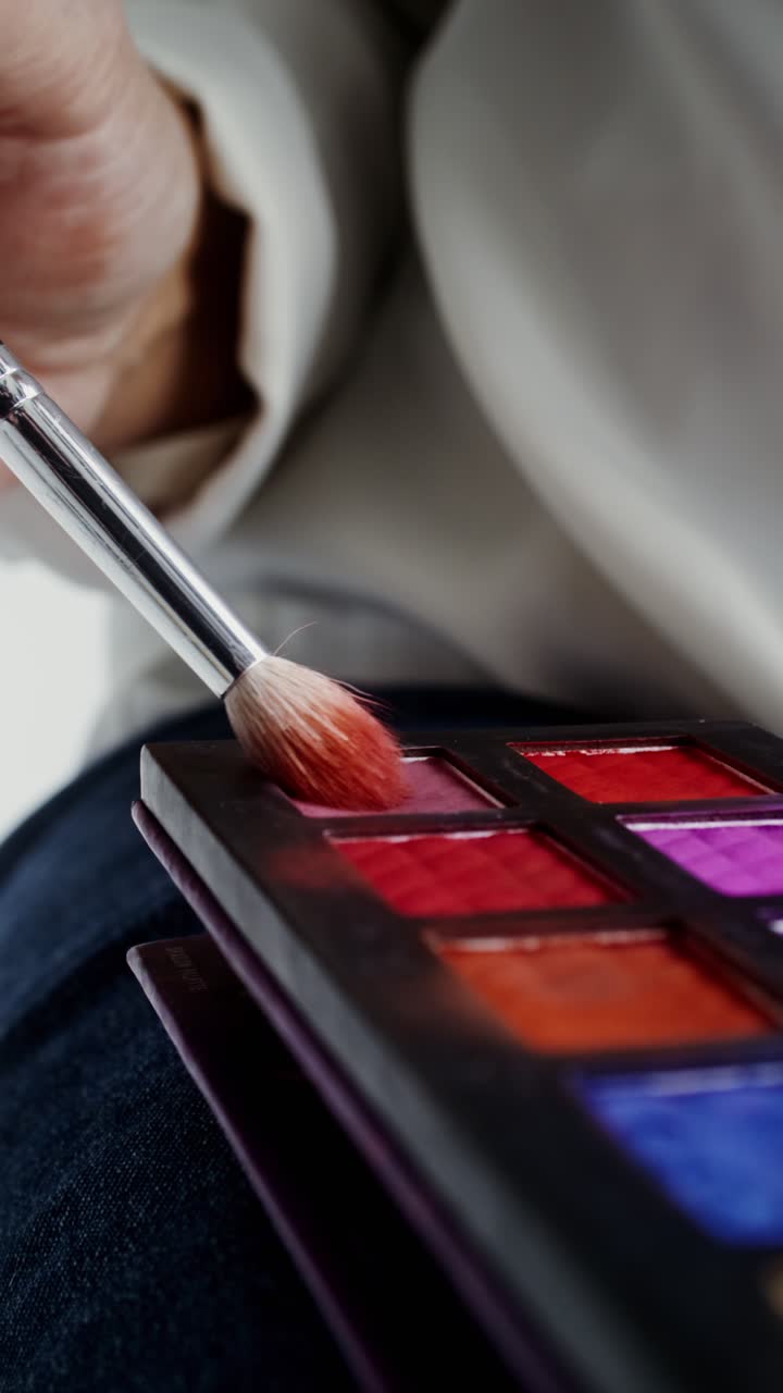 Close-up of a Makeup Palette and Brush