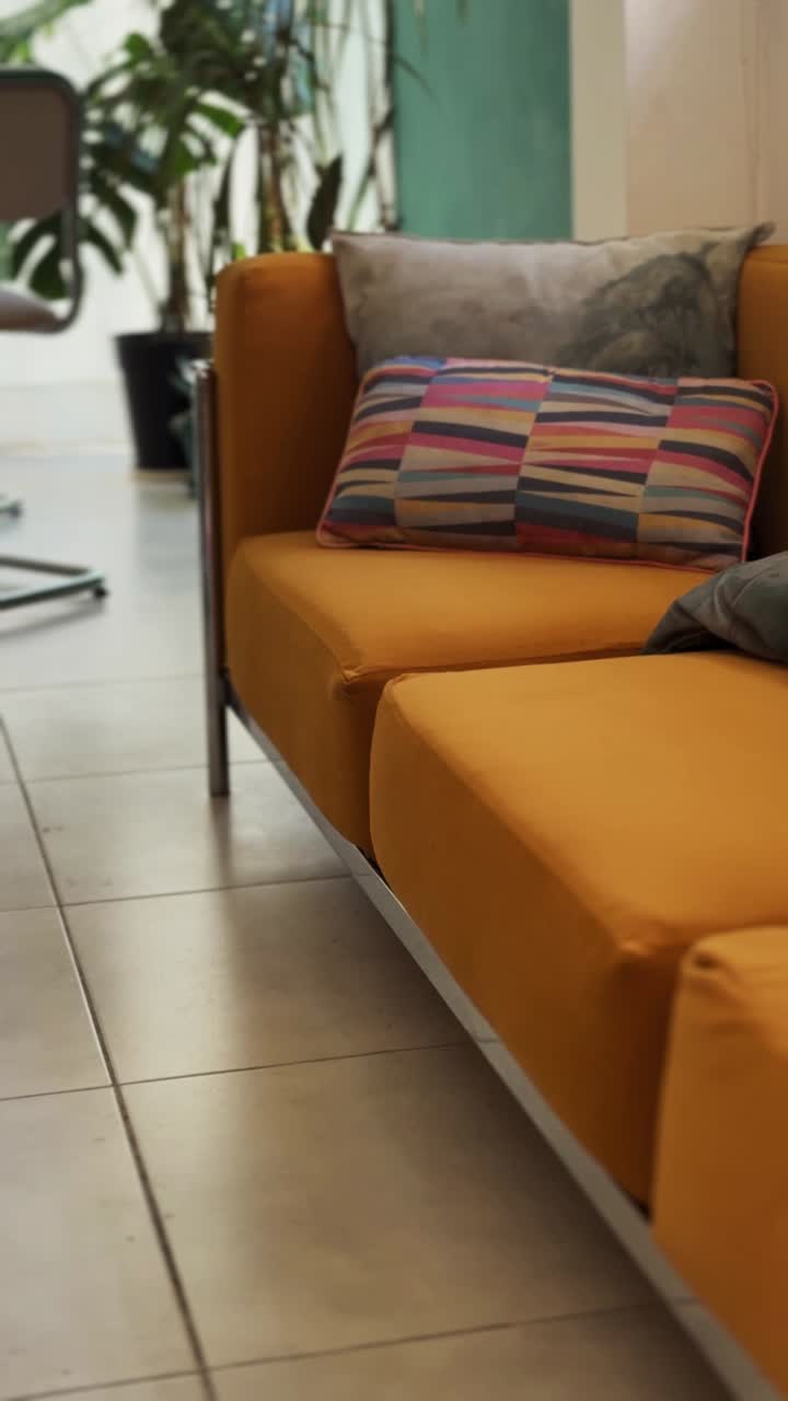 Modern Mustard Yellow Sofa with Colorful Cushions in a Stylish Interior